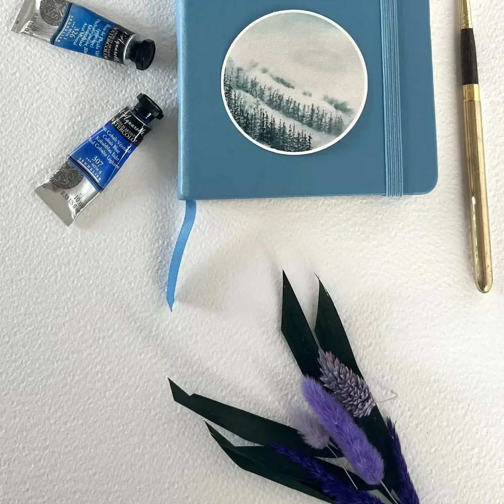 Hand-painted Mountain winter forest vinyl sticker on notebook