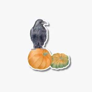 Raven on pumpkins vinyl sticker on a laptop