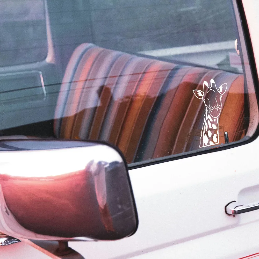 Handcrafted giraffe vinyl decal on car window