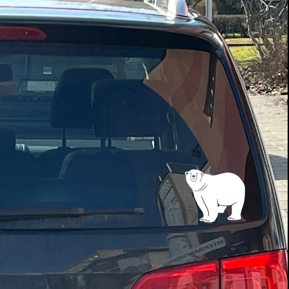 Handcrafted polar bear vinyl decal on car window